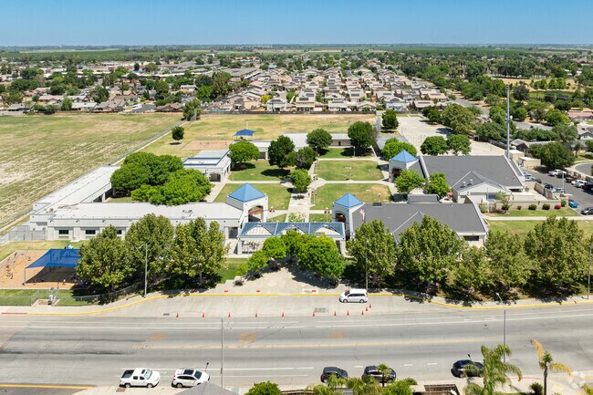 Cinnamon Elementary School provides large green areas and play equipment for students to enjoy.
