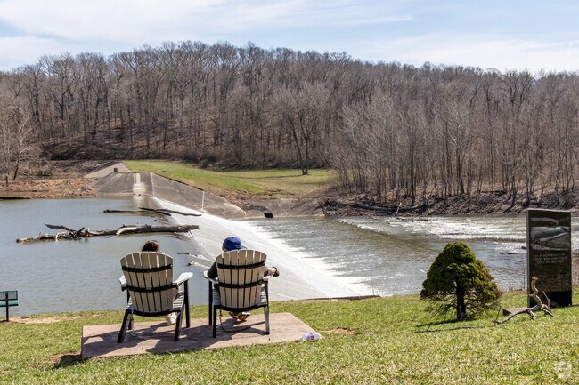 Residents of Charleston enjoy the view of a dam at the Embarras River.