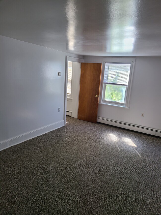 Living room showing access to storage/office