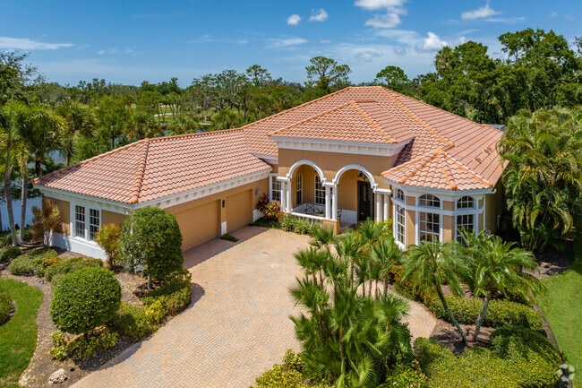 Terracotta roofs, arched entryways, and paver driveways are found in Boca Royale.
