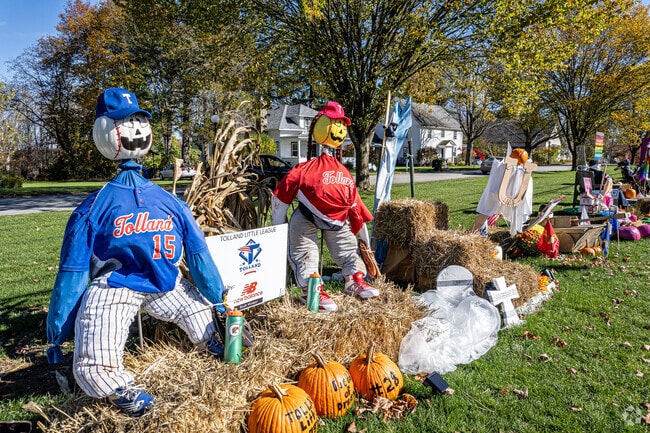 Businesses and organizations in Tolland make scarecrows on the Town Green every fall.