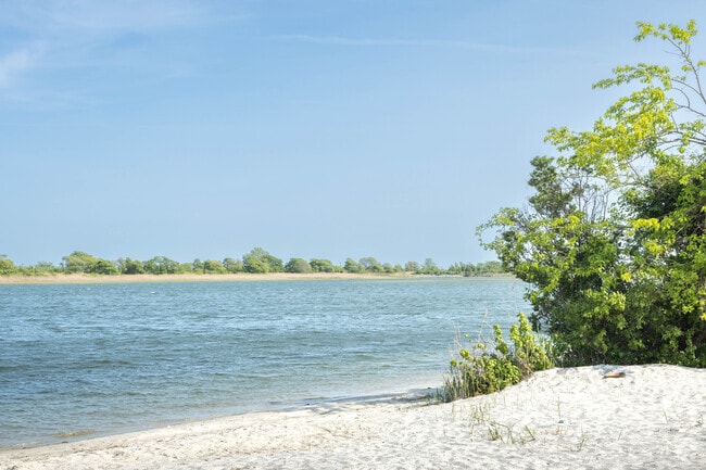 There is a small sandy beach at Cow Meadow Park in Freeport.