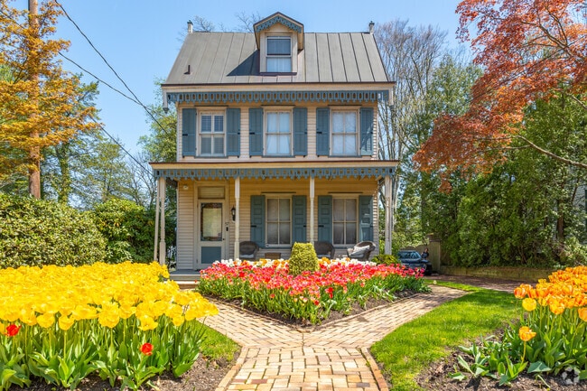 Colonial symmetry meets Victorian frills with pristine gardening on homes in Haddonfield.