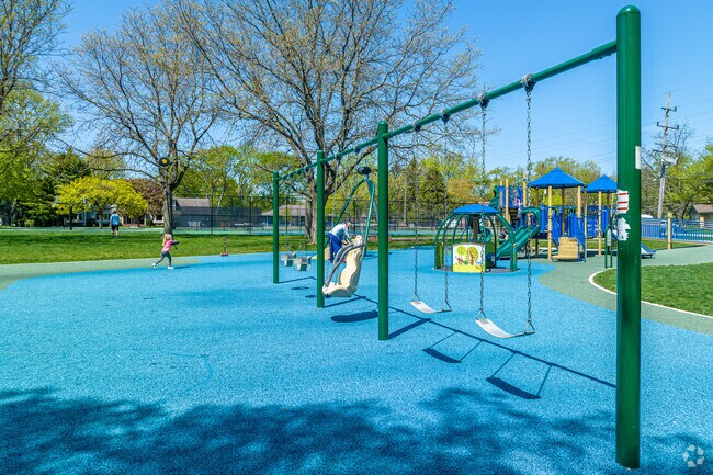 Palmer Park has a playground with swings and a jungle gym for Downtown Palos Heights residents.