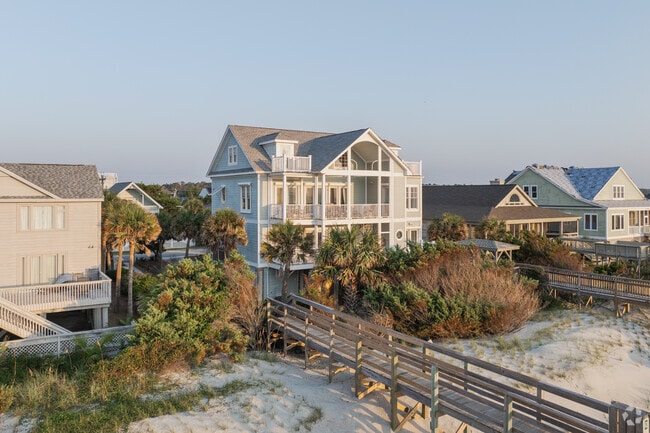 Oceanfront homes with double porches and beach access are popular in Litchfield Beach.