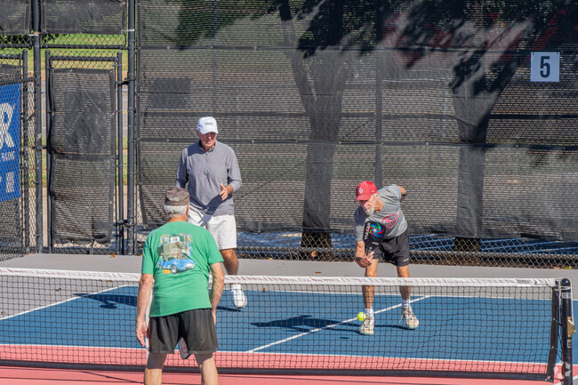 Huntwick residents can enjoy a game of pickleball at nearby Kickingbird Golf.
