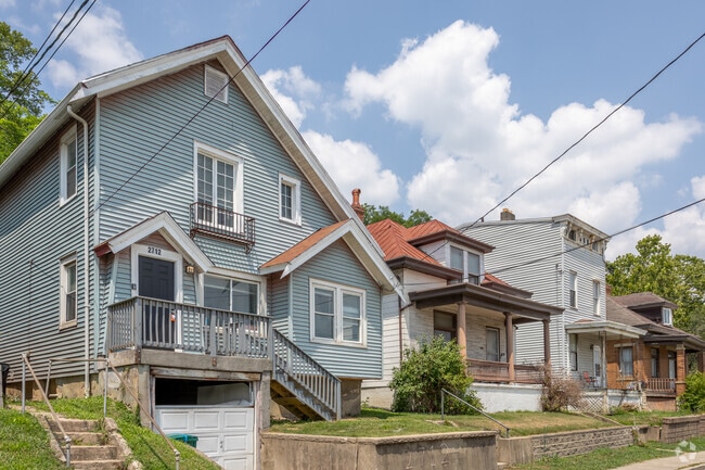 A row of homes in Riverside Sedamsville shows off the varied architecture in the neighborhood.