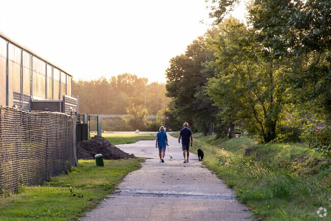 A couple takes an evening stroll along the walkways behind Russell Shifley park in Shifley-York.
