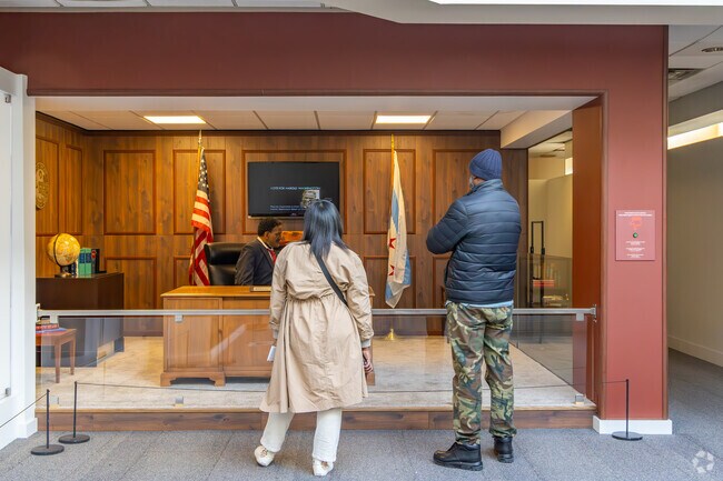 Visitors take in an exhibit at DuSable Museum of African American Culture in Washington Park.