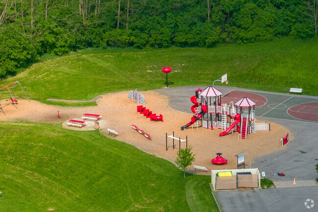 Tecumseh Elementary features a red playground for students.