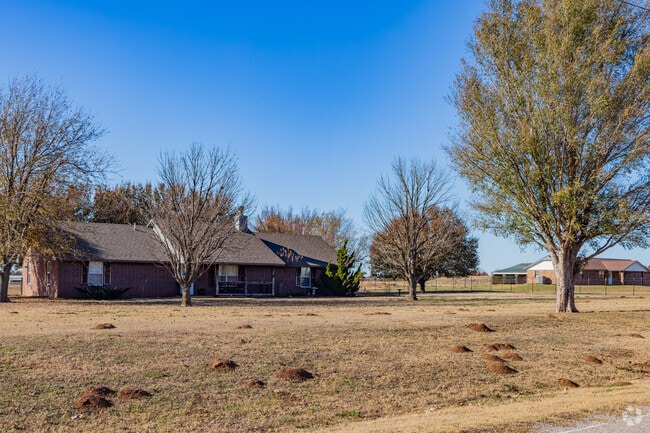 Ranch houses with large yards are common in the Maguire neighborhood of Slaughterville.