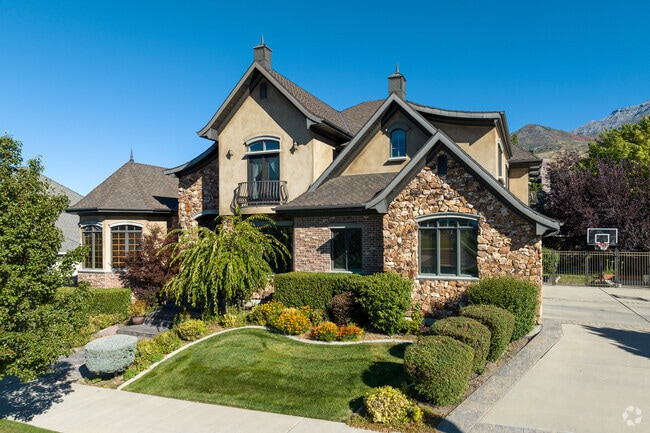 Manicured yards complement two-story homes in Old Orchard’s residential blocks.