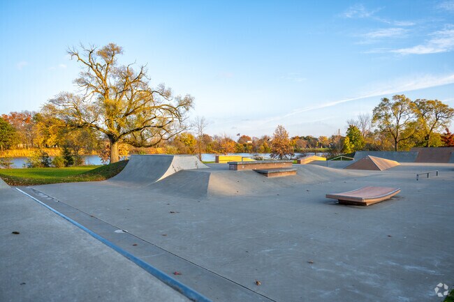 Skaters gather at Hyde Park’s lakeside skate park, which features ramps and rails.