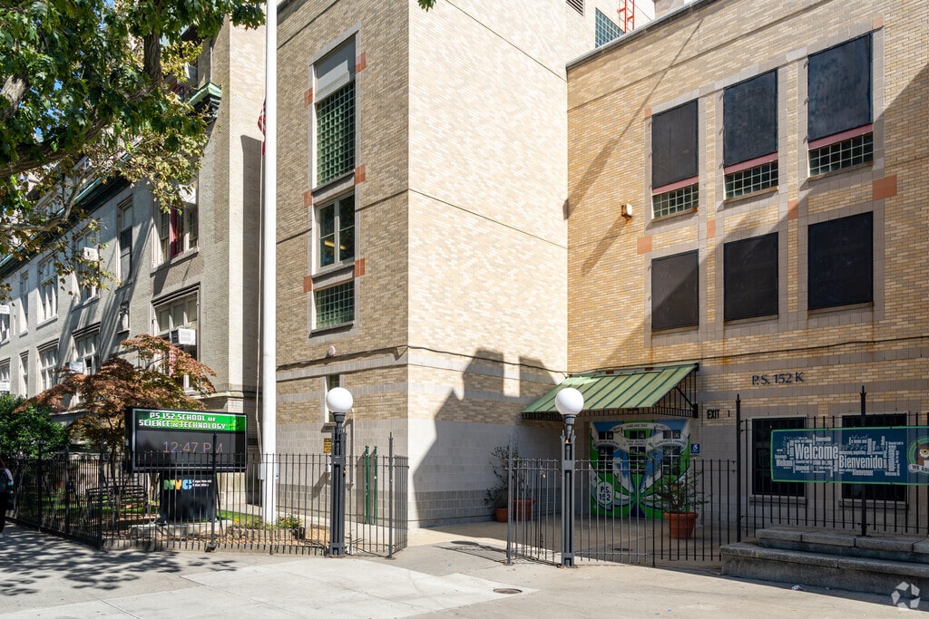 The entrance to P.S. 152 School of Science & Technology is located along E 23rd St.