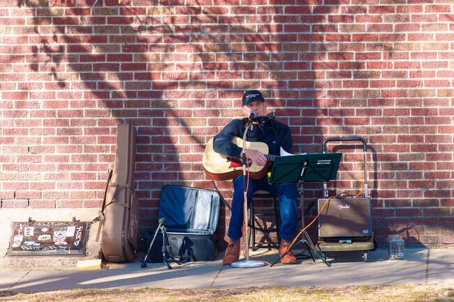 You'll sometimes be treated to street music in Platt Park when exploring Pearl St.