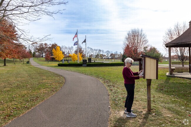 Find a new book while on a walk through Adams Township Community Park.