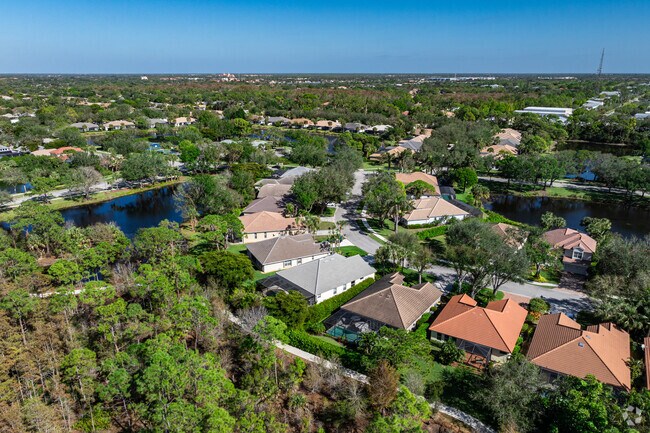 Autumn Woods is a private gated community with mature trees, lakes, and scenic views.