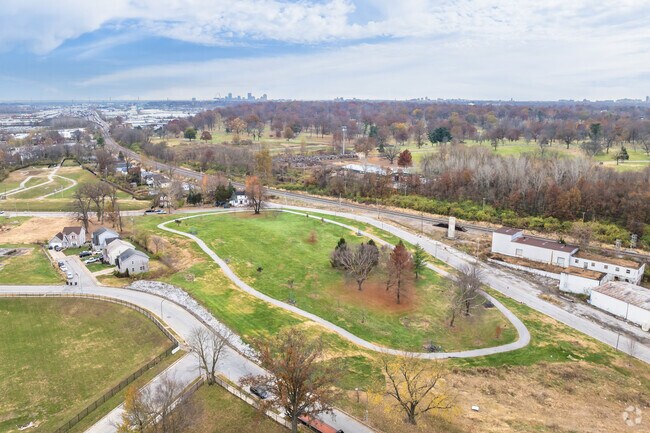 Dickman Park in Baden has a large paved running or walking path that encircles the entire park.