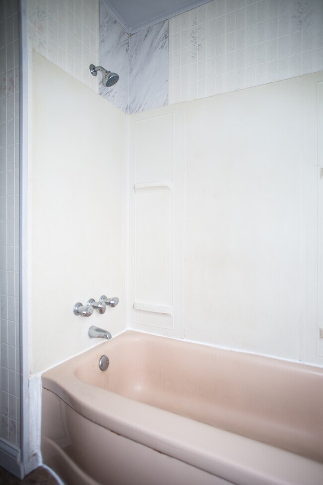 Bathtub with shower.