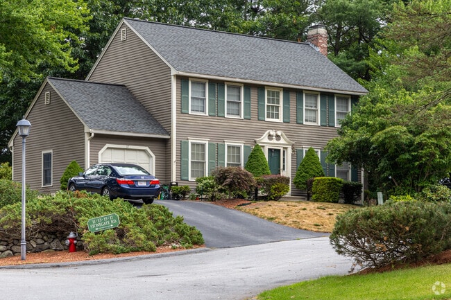 A contemporary Colonial Revival styled home sits on a hill in the Golden Triangle neighborhood.