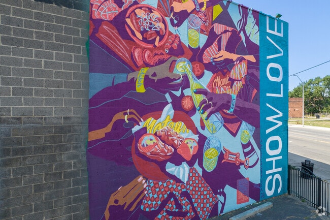 An Andrea Sztuka mural greets visitors to Grandmont along Grand River.