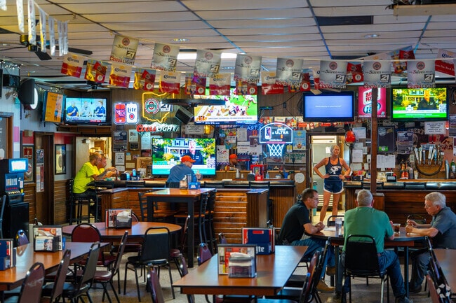 Inside McSober, locals enjoy food and drinks under sports-themed decor in Coldwater.