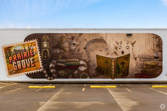 A mural merges the city of Prairie Grove with the public library.
