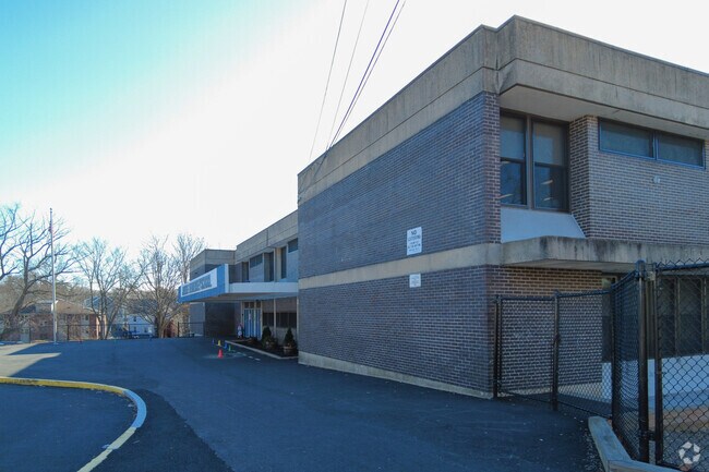 There is fencing to protect the security of students at James F. Hennessey School.