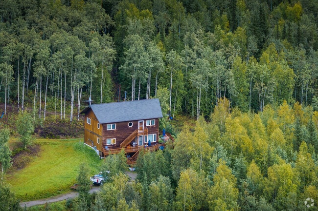 A two-story home is located off a quiet residential dirt road in Goldstream.