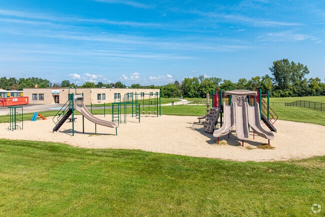 A playground provides slides & climbing structures for the students at West Ridge Elementary.