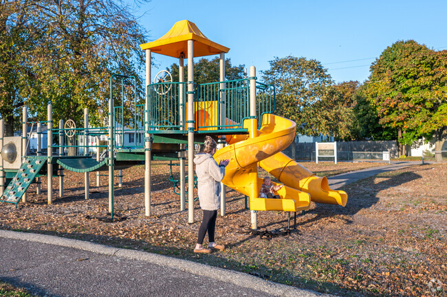 Children of Strawberry Hill enjoy the slides at George A. Jones Playground.
