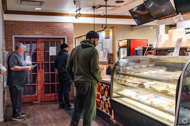 Customers order ribs and sandwiches at B&M Barbeque.