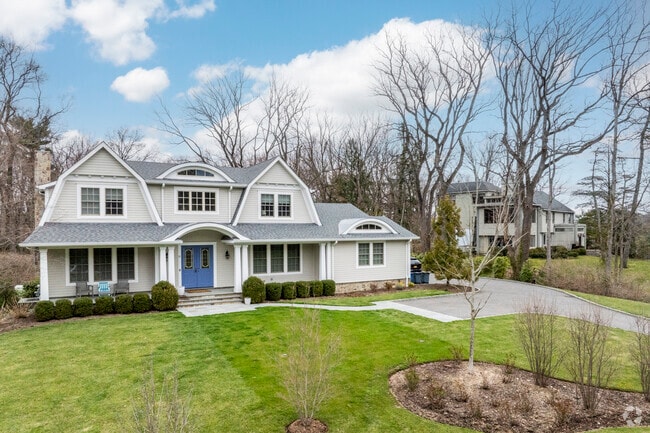 Dutch Colonial style homes can also be found throughout Roslyn Estates, featuring large plots.