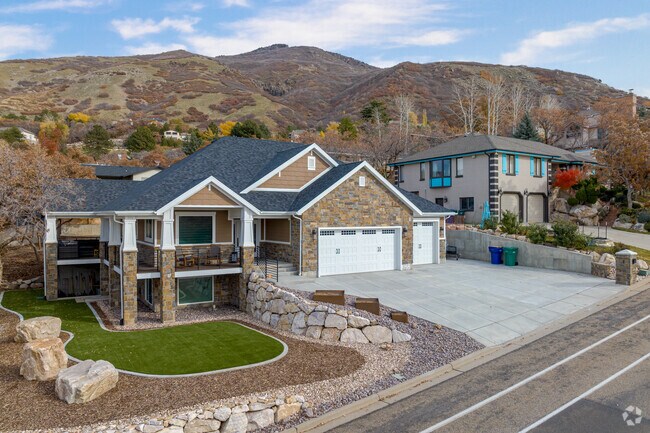 Beautiful two story homes with landscaped yards sit in the mountains in Southeast Ogden.