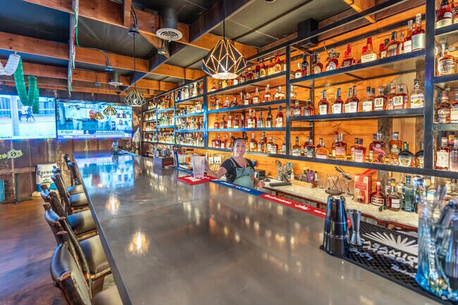 The bar is well stocked with bourbon and tequila at El Maguey's in Brooks.