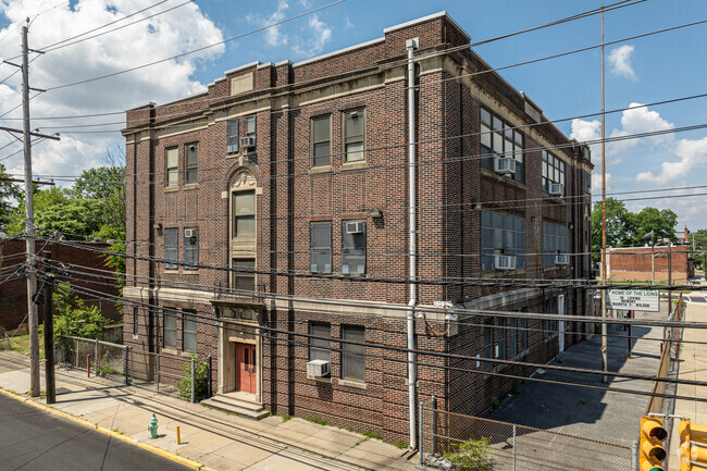 The early-20th-century architecture of Pride Academy matches the rowhome style in Camden.