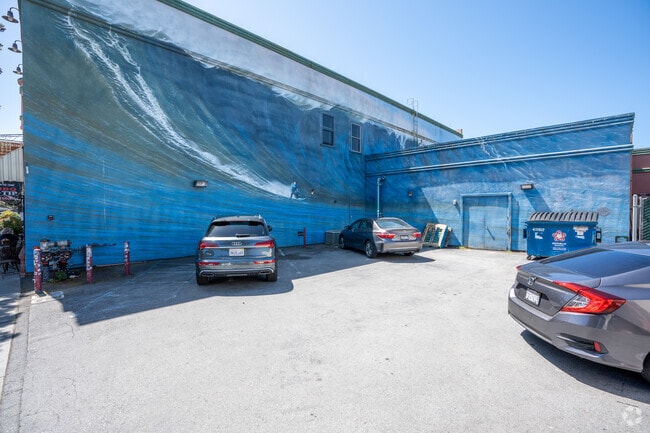 A mural in Half Moon Bay depicts a majestic wave, celebrating the surf culture.