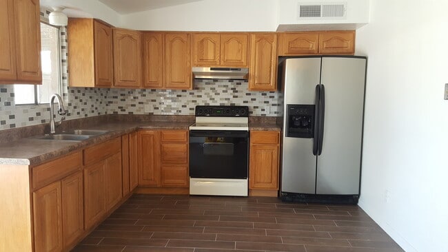 Kitchen with tile backsplash