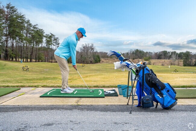 Swing by the range at Compass Pointe Golf Courses in Lake Shore.