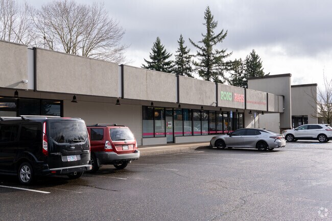 Parking spaces sit in front of the student entrance.