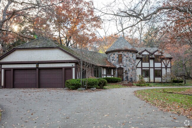 Experience the epitome of Tudor Revival charm in this elegant Braemar Hills home.