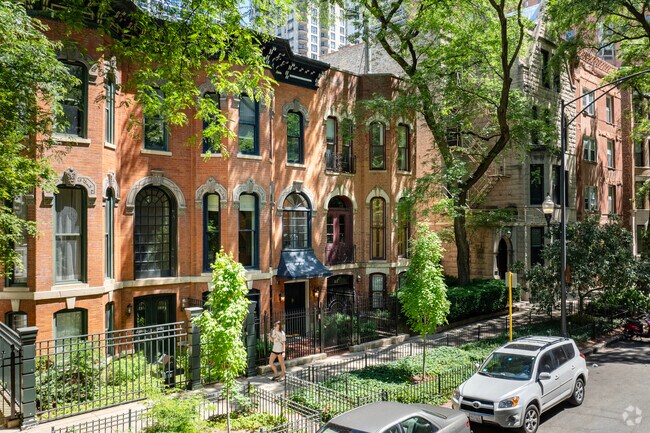Luxury single family brick homes sit on tree lined streets in the Rush -Division neighborhood.
