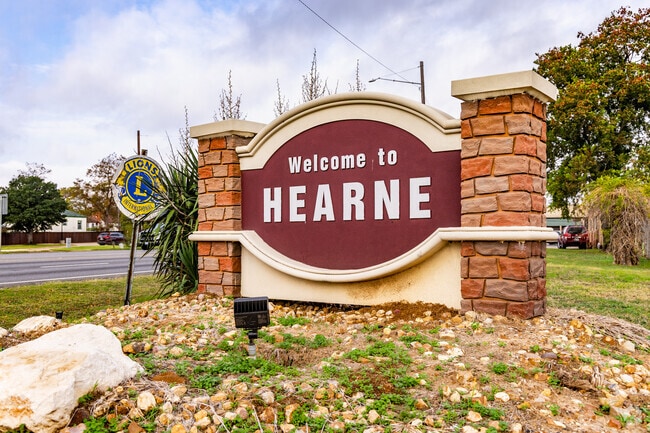 Hearne neighborhood streets include mature trees and lawns with a variety of home prices.