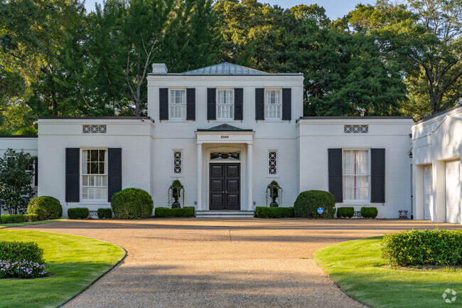 Neoclassical homes in Garrard Woods typically feature symmetric facades and ornamental details.