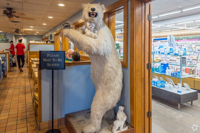 A Polar Bear stands by the doorway at the North Pole Restaurant in the city of Newport.
