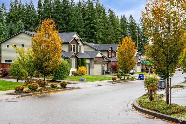 A row of modern Craftsman-style homes lines the streets of a Canyon Park neighborhood.