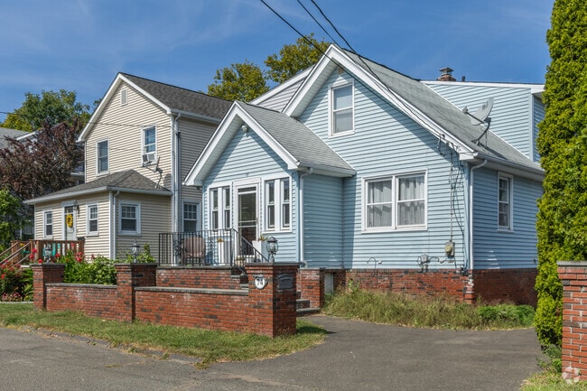Gravel driveways and stone walls frame classic homes in East Side Stamford.