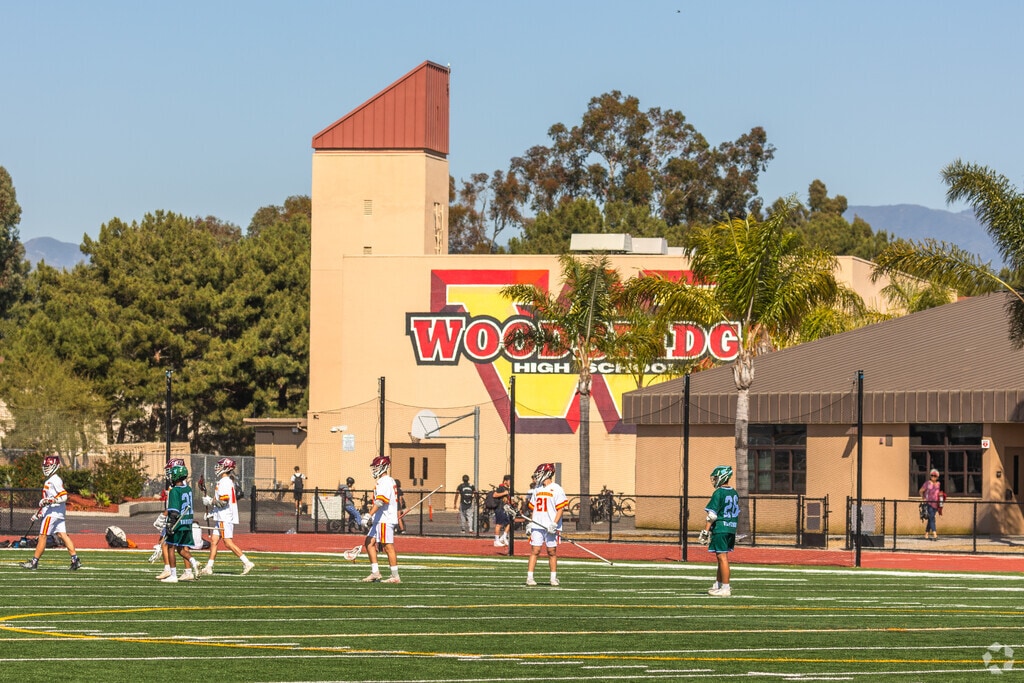 Woodbridge Varsity Boys Lacrosse team playing at Woodbridge High School in Irvine.