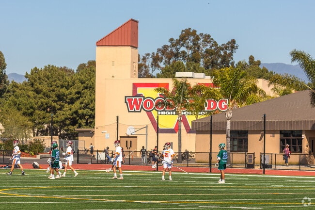 Woodbridge Varsity Boys Lacrosse team playing at Woodbridge High School in Irvine.