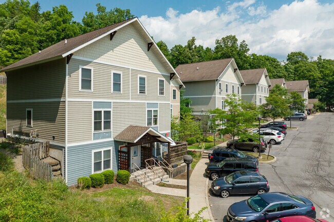 Some homes in West Hill are multifamily homes with shared parking.